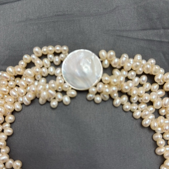 Salt Water Pearl Necklace
6 strand / 18 inches 
Magnetic mother of pearl clasp - Picture 2 of 7
